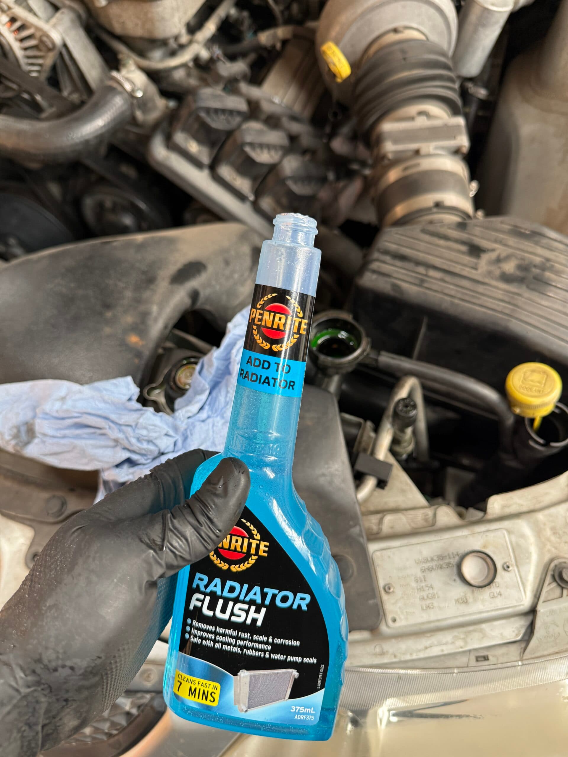 Penrite Radiator Flush beside the Holden Commodore radiator filler neck