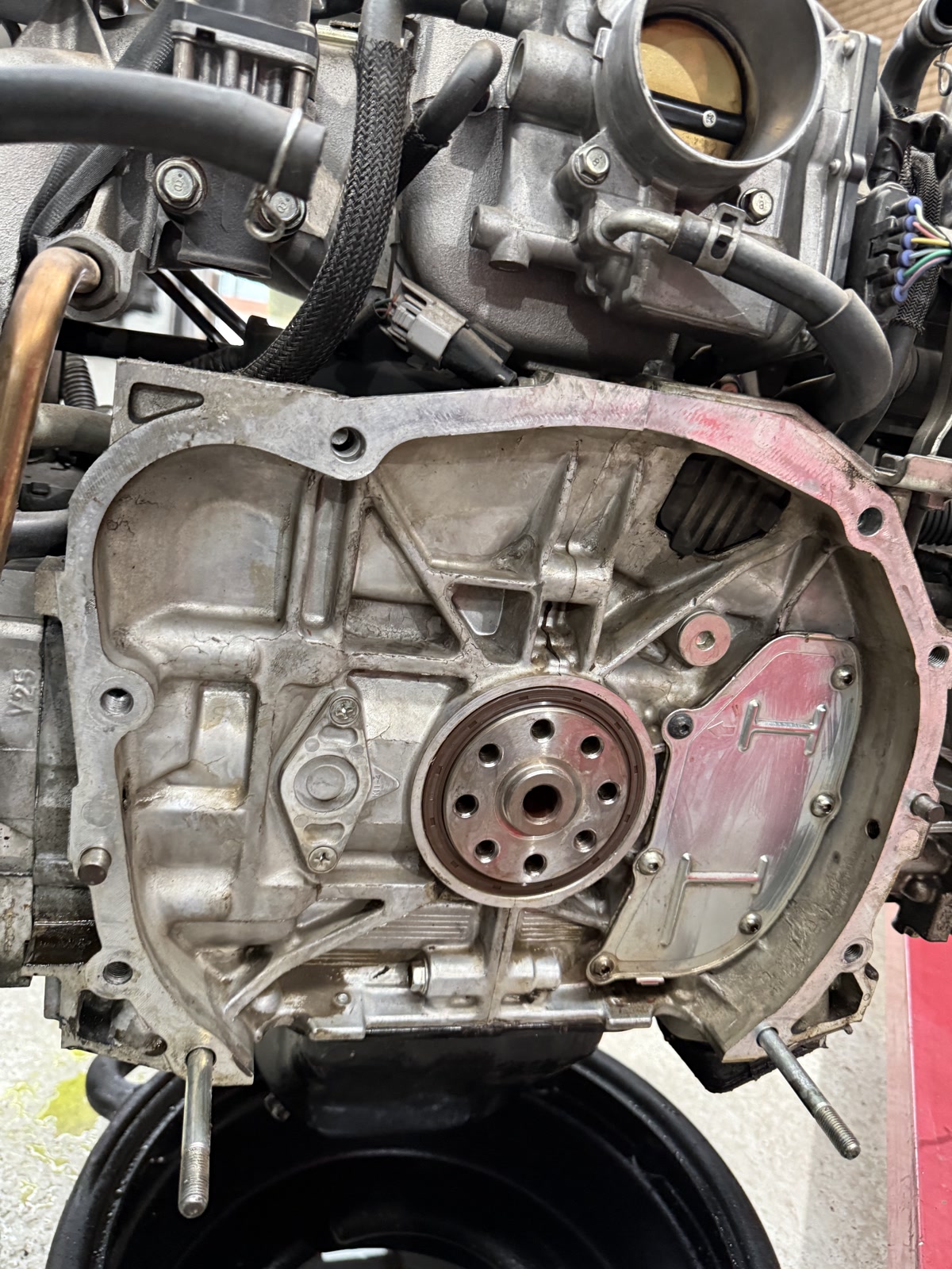 Replacement Subaru rear main seal fitted into the cleaned housing.